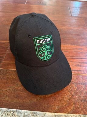 New Era Black Cap with Green Embroidered Crest